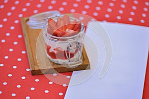 Dessert panna cotta with fresh strawberries served in a glass, selective focus. Delicious fruit creamy dessert