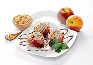 Dessert of peaches, cream and chopped hazelnuts