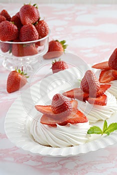 Dessert platter of strawberry meringue nests