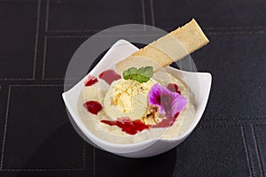 Dessert of rice, milk and peach ice cream photo