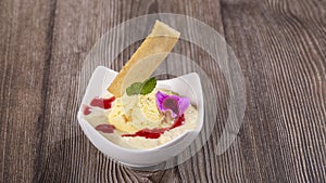 Dessert of rice, milk and peach ice cream photo