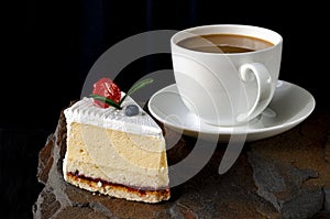 Dessert. A slice of cherry cake and a cup of coffee