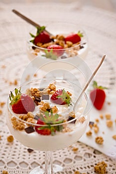 Dessert with strawberries cereals and chocolate flakes