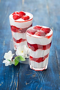 Dessert with strawberry sauce in glass
