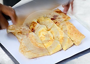 Dessert style of fried Roti with banana in Thailand