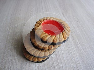 dessert sweet chocolate chip cookies with red thick jelly