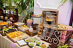 Dessert table of delicious snacks on wedding reception