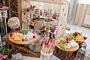 Dessert table of delicious snacks on wedding reception