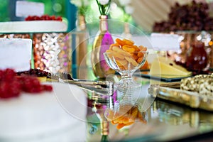 Dessert table for a party. Candy bar. Rich thematic wedding candy bar high variety of sweets