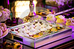 Dessert table for a party. Candy bar. Rich thematic wedding candy bar high variety of sweets