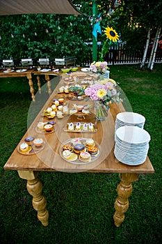 Dessert table for a party Candy bar. Rich thematic wedding candy bar, high variety of sweets