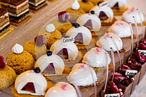 Dessert table for a party. Ombre cake, cupcakes. Candy bar