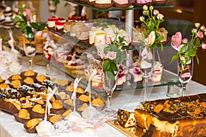 Dessert table for a party. Ombre cake, cupcakes. Candy bar