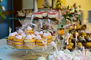 Dessert table for a party. Ombre cake, cupcakes. Candy bar