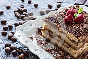 Dessert Tiramisu Cake with Grated Chocolate, Raspberry and Mint