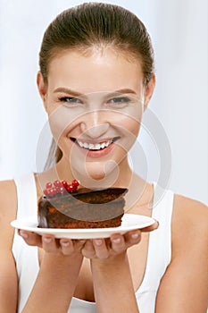 Dessert. Woman Eating Chocolate Cake