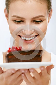 Dessert. Woman Eating Chocolate Cake