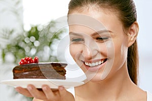 Dessert. Woman Eating Chocolate Cake