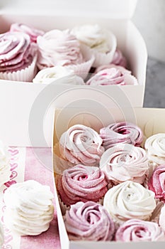 Dessert zephyr marshmallows close up. Big zephyr sprinkled with powdered sugar. Valentine`s Day concept. Food photography