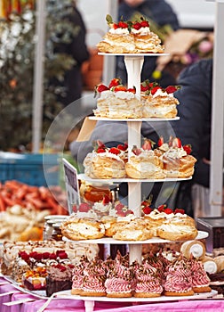 Desserts for sale on the table of a local pastry stall.