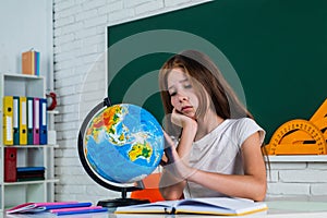 Destination place. teen girl work in classroom near blackboard. cheerful kid learning geography. modern education