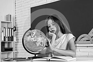 destination place. teen girl work in classroom near blackboard. cheerful kid learning geography. modern education