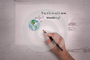 Destination wedding sign sketch of the world with airplane doodle photo