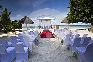 Destination wedding on a white sand beach during summer.