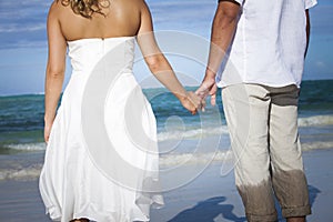 Destination wedding on a white sand beach during summer