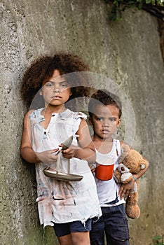 Destitute african american children with plate photo