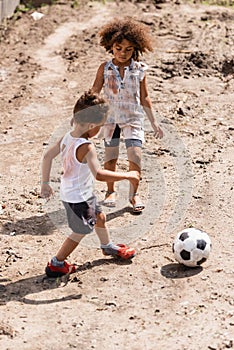 Destitute african american kids playing football