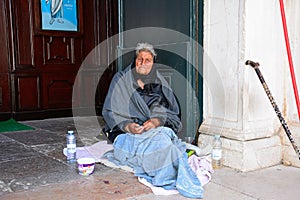 Destitute lady begging for money, Lagos, Portugal.