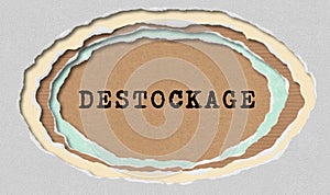 Destockage - Typewritten Word in Ragged Paper Hole Background