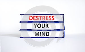 Destress your mind symbol. Concept words Destress your mind on books. Beautiful white table white background. Psychological