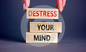 Destress your mind symbol. Concept words Destress your mind on wooden blocks. Doctor hand. Beautiful grey table grey background.