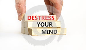 Destress your mind symbol. Concept words Destress your mind on wooden blocks. Doctor hand. Beautiful white table white background
