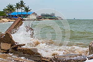 Destroed stone pier, splash wave sea