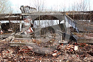 Destroyed abandoned hangar ruins. Farm building destroyed by weather after economic crisis