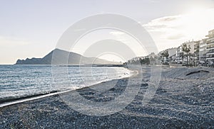 The destroyed beach in Altea after storm Gloria in January 2020 with view on coast and mountain range, Altea, Costa Blanca, Spain photo