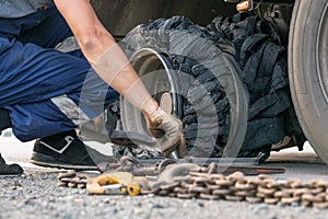 Destroyed blown tire with crushed and damaged rubber on a truck.