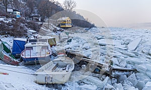 Destroyed boats on frozen Danube