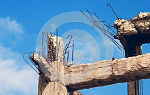 Destroyed building, debris.