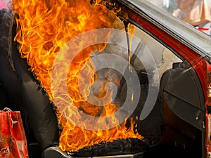 Destroyed car on fire in a fire service show