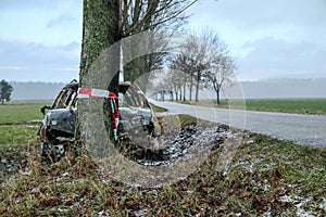 Destroyed car standing by the road