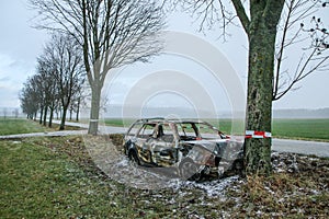 Destroyed car standing by the road