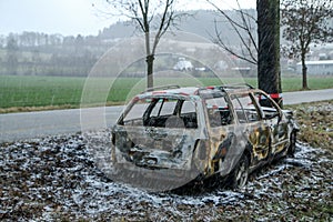 Destroyed car standing by the road