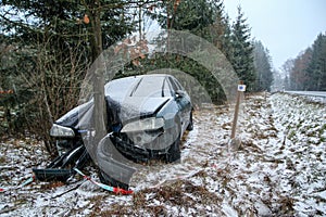 Destroyed car standing by the road