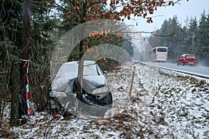 Destroyed car standing by the road