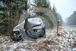 Destroyed car standing by the road