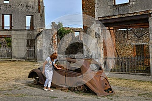 Destroyed cars and buildings during World War 2 in the city Oradour sur Glane France